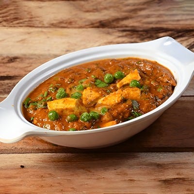 13. Matar Paneer.